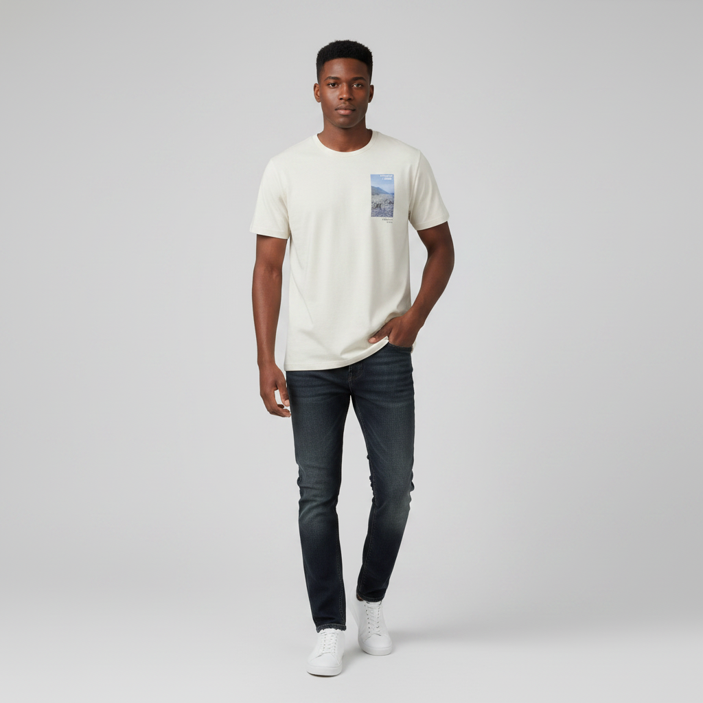 Young Nigerian male wearing off-white Embrace Unity coastal photo print crew neck tee