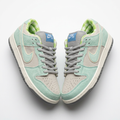 Pair of mint and grey rope-lace low-top sneakers on a white background