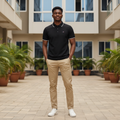 Young Nigerian male model wearing black polo with white tipped collar