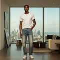 Nigerian model wearing light blue distressed baggy denim jeans with white t-shirt