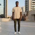 Plain Beige Tee front view on Nigerian male model