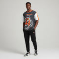 Young Nigerian male wearing charcoal grey NFL Cincinnati Bengals tiger graphic tee