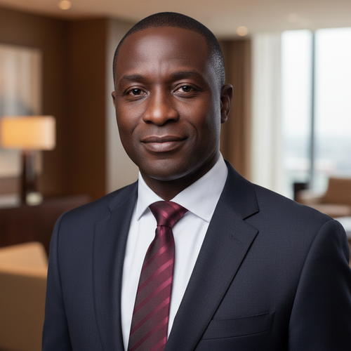 Nigerian man wearing maroon striped necktie with white shirt and dark suit