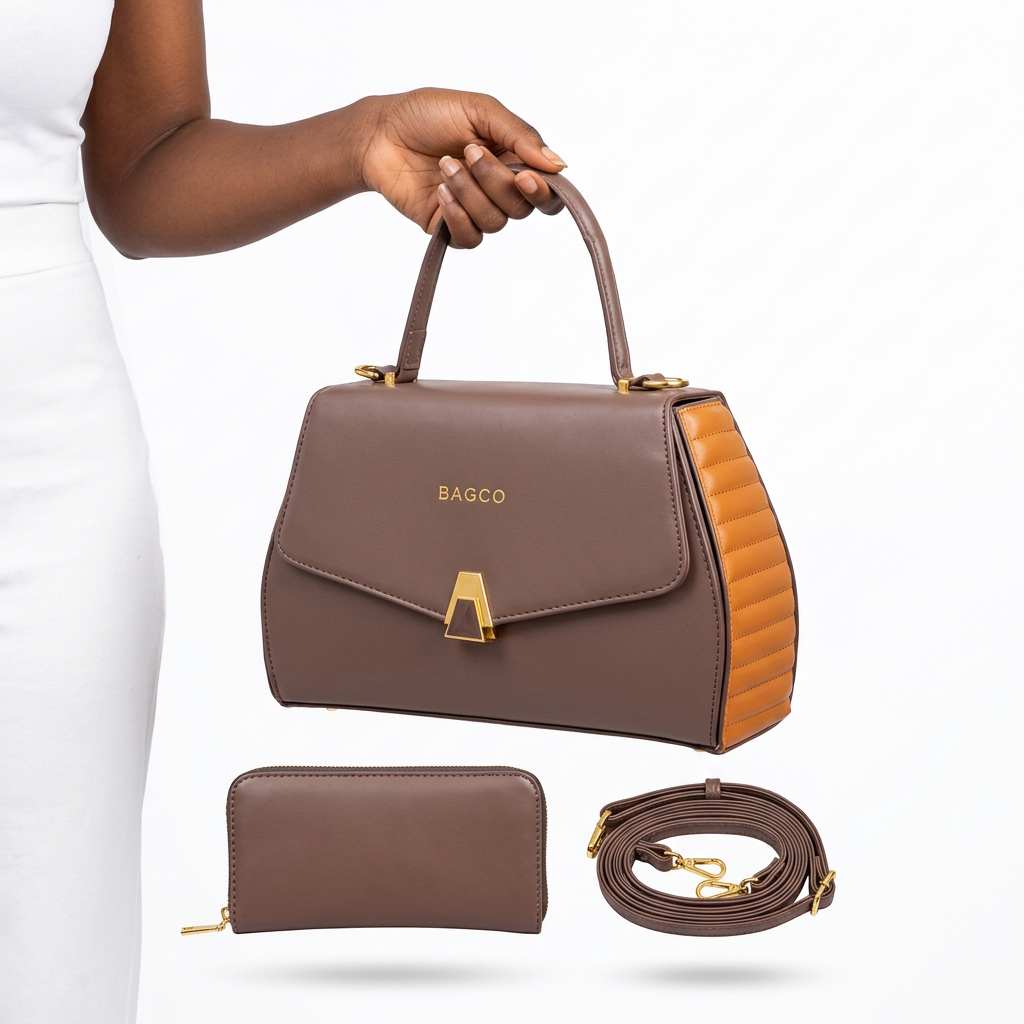 Hand holding a taupe handbag with caramel ribbed sides and matching accessories