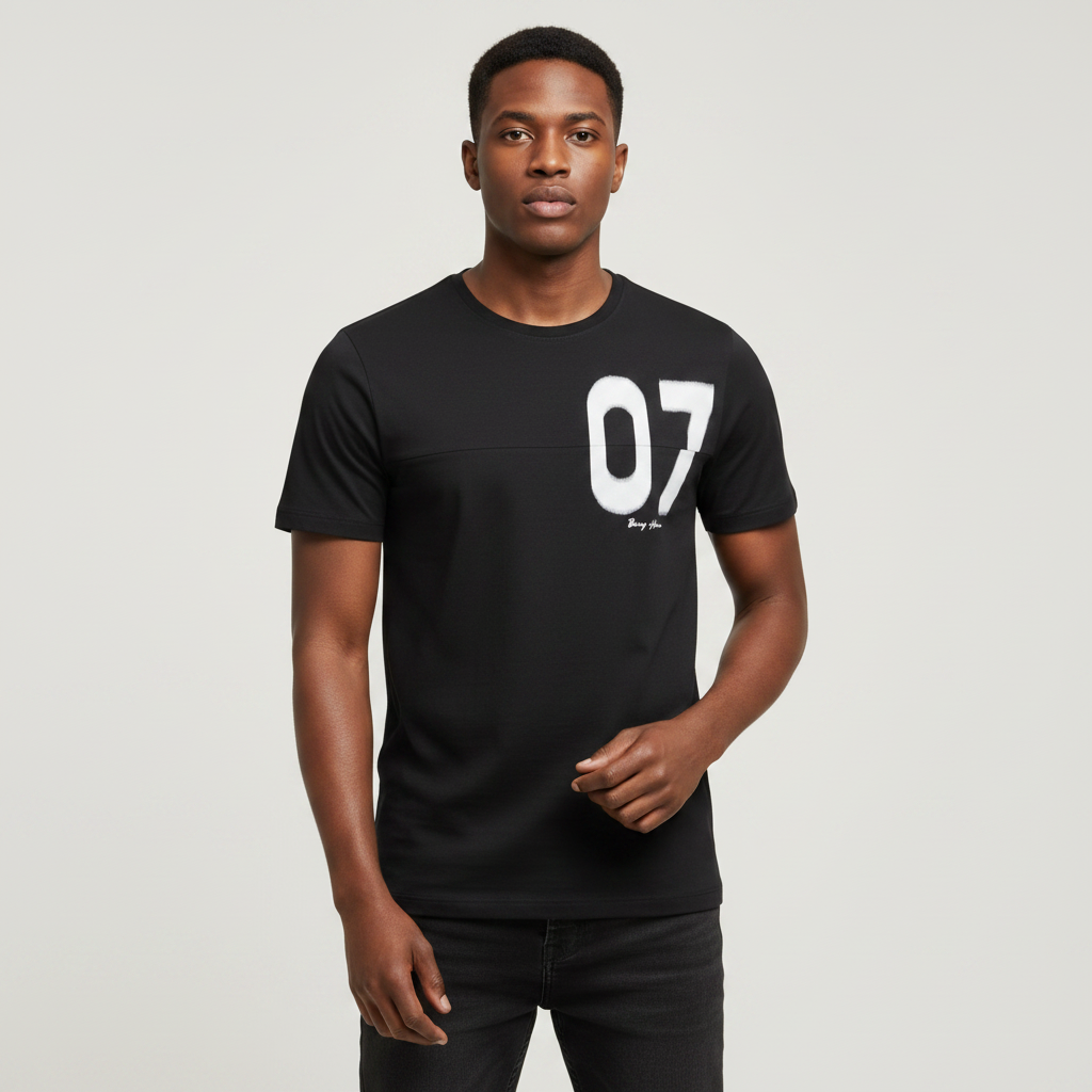 Young Nigerian male wearing jet black 07 spray paint graphic crew neck tee