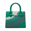 Emerald green teal and mint curved-panel handbag on white background