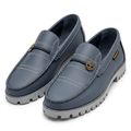 Pair of slate-blue chain-emblem loafers with grey lug soles on white