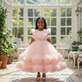 Young Nigerian girl wearing pink tulle ball gown
