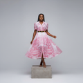 Nigerian female model wearing pink baroque print belted shirt dress