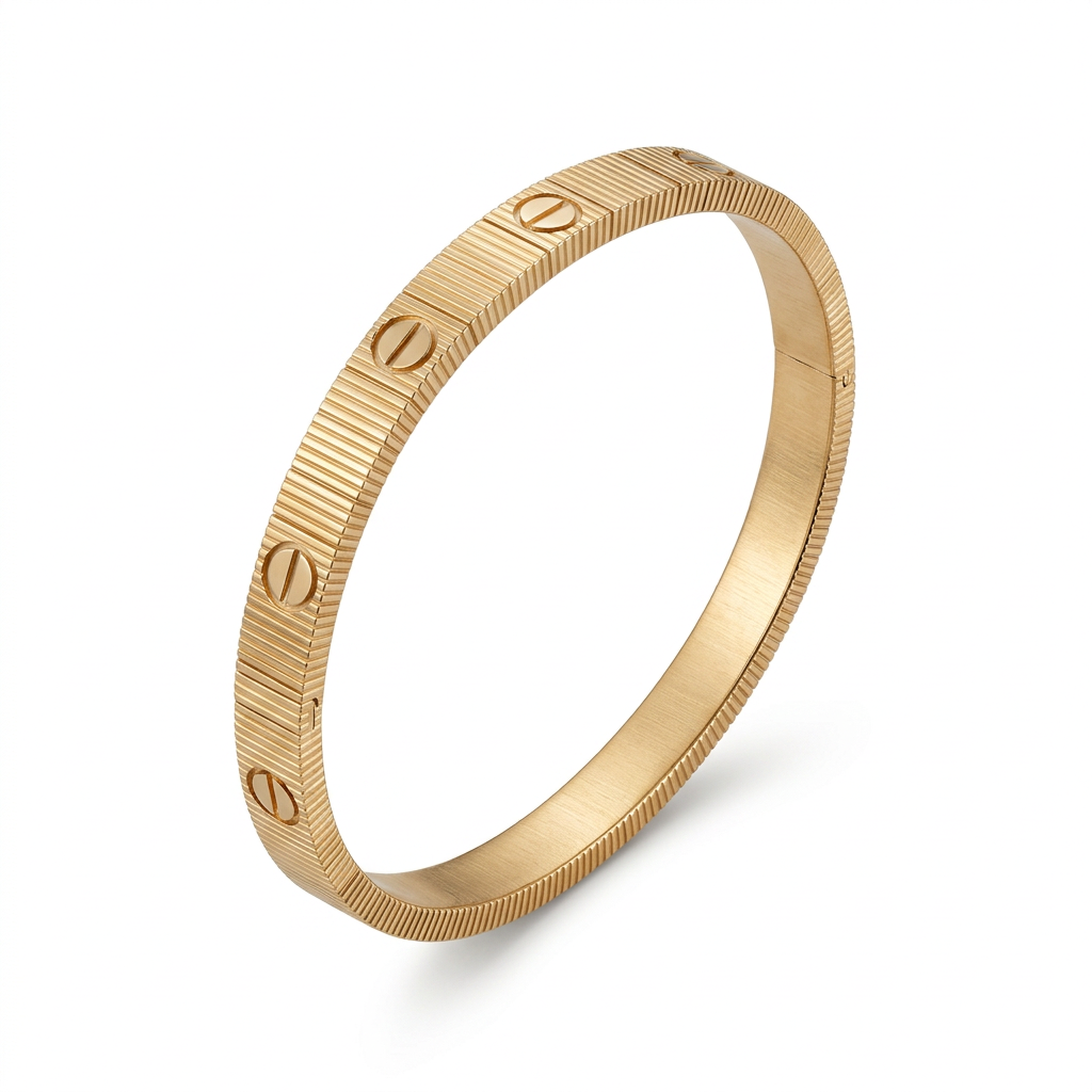 Gold-tone ribbed screw-detail bracelet isolated on plain white