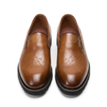 Straight-on tan brown script-detail slip-on shoes with chunky black soles