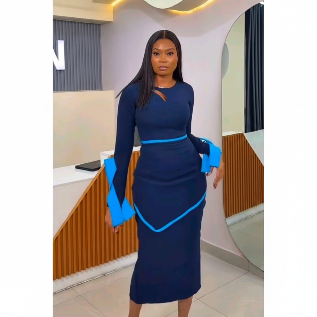 Black Nigerian model wearing the navy blue women’s gown with blue trim