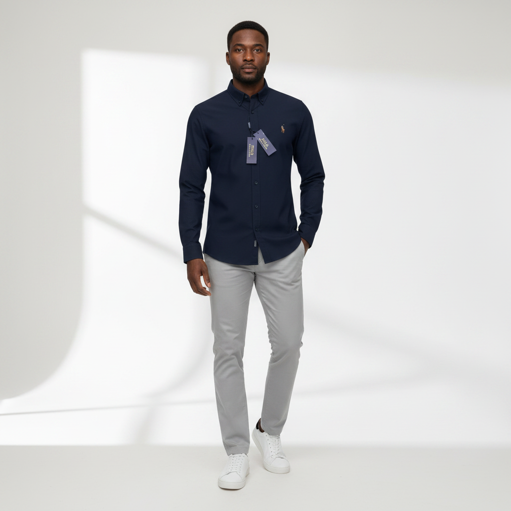 Nigerian adult male model wearing Navy Oxford Long Sleeve Shirt – Front View