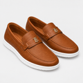 Brown buckle-detail loafer pair on a clean background
