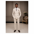 Ivory double-breasted suit on Nigerian male model