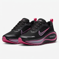 Black lace-up sneakers with pink trim and grey-lilac sculpted soles