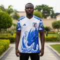 Nigerian male model wearing white and blue dragon flame football jersey front view