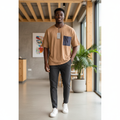 Nigerian male model wearing camel oversized t-shirt with navy contrast pocket