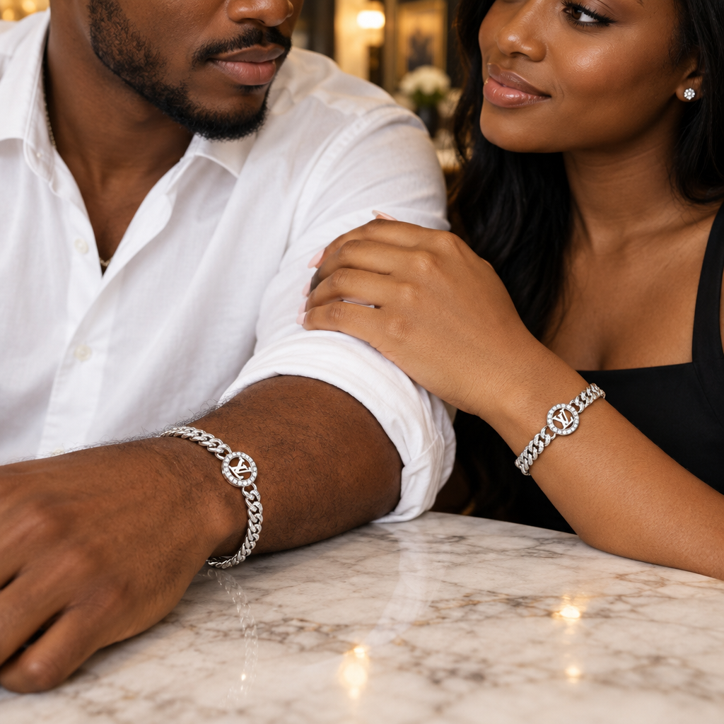 Man and woman each wearing the silver crystal curb chain charm bracelet