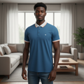 Young Nigerian male model wearing steel blue tipped polo shirt, front view