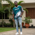 Nigerian male model wearing teal eagle graphic sports tee in casual streetwear style