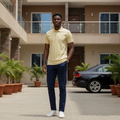 Young Nigerian male model wearing yellow vertical stripe polo shirt