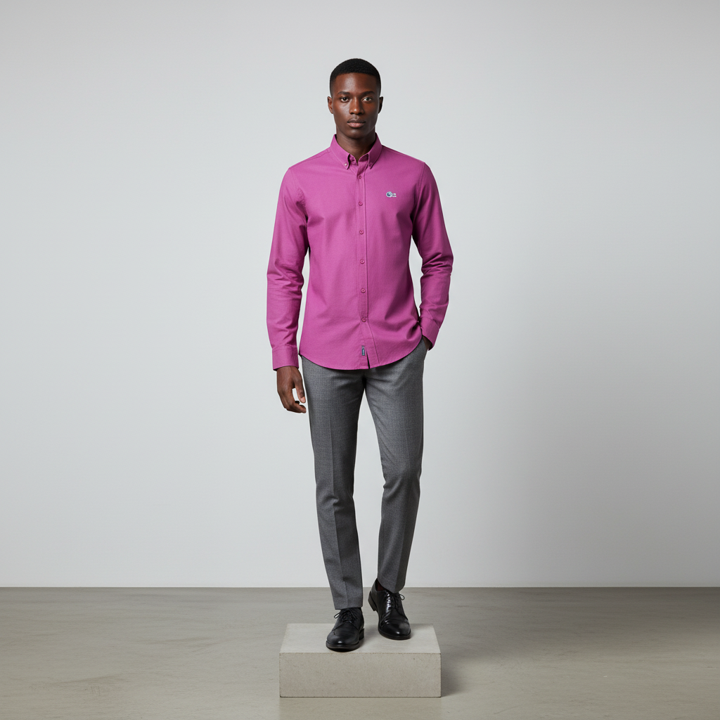 Nigerian male model wearing magenta pink plain long-sleeved shirt, front view