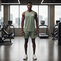 Adidas sage green perforated sleeveless sport vest on male model