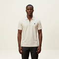 Ivory polo model on a plain off-white background