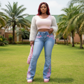 Model Shot - Light Blue High-Waist Bootcut Jeans with Pink Floral Embroidery