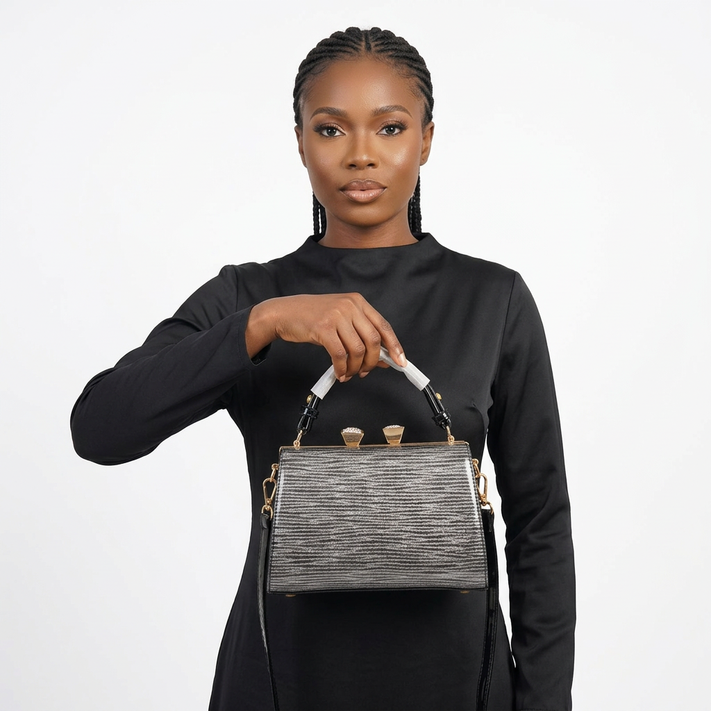 Silver ridged top-handle bag with a Nigerian model