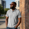 STEEZU Super Premium Grey Button Polo shirt with a heathered texture, structured collar, and raglan seam detailing. Made from a cotton blend.