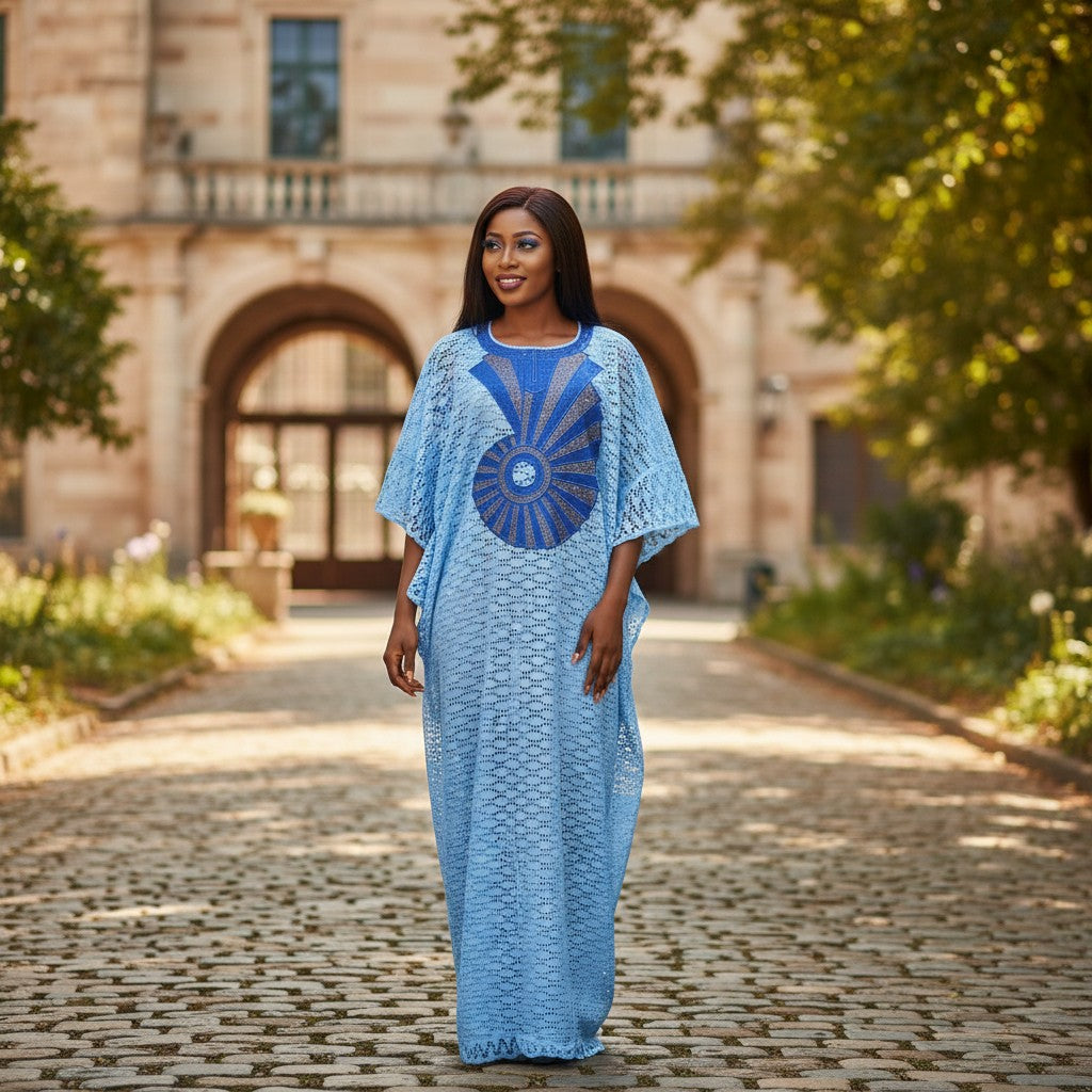 STEEZU light blue lace kaftan dress with sunburst rhinestone embellishment on chest and wide sleeves.