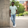 STEEZU pistachio green polo with white stripes, quarter-zip, and structured collar.