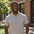 STEEZU Stone Taupe Quarter-Zip Polo shirt with horizontal and vertical stripe pattern. Short sleeves, collared, and zipper closure.