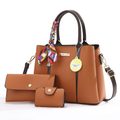 Tan scarf-handle handbag studio preview